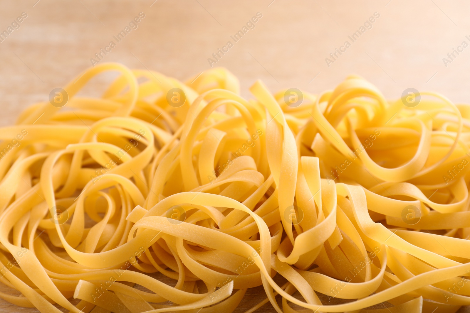 Photo of Raw egg noodles, closeup. Traditional Asian meal