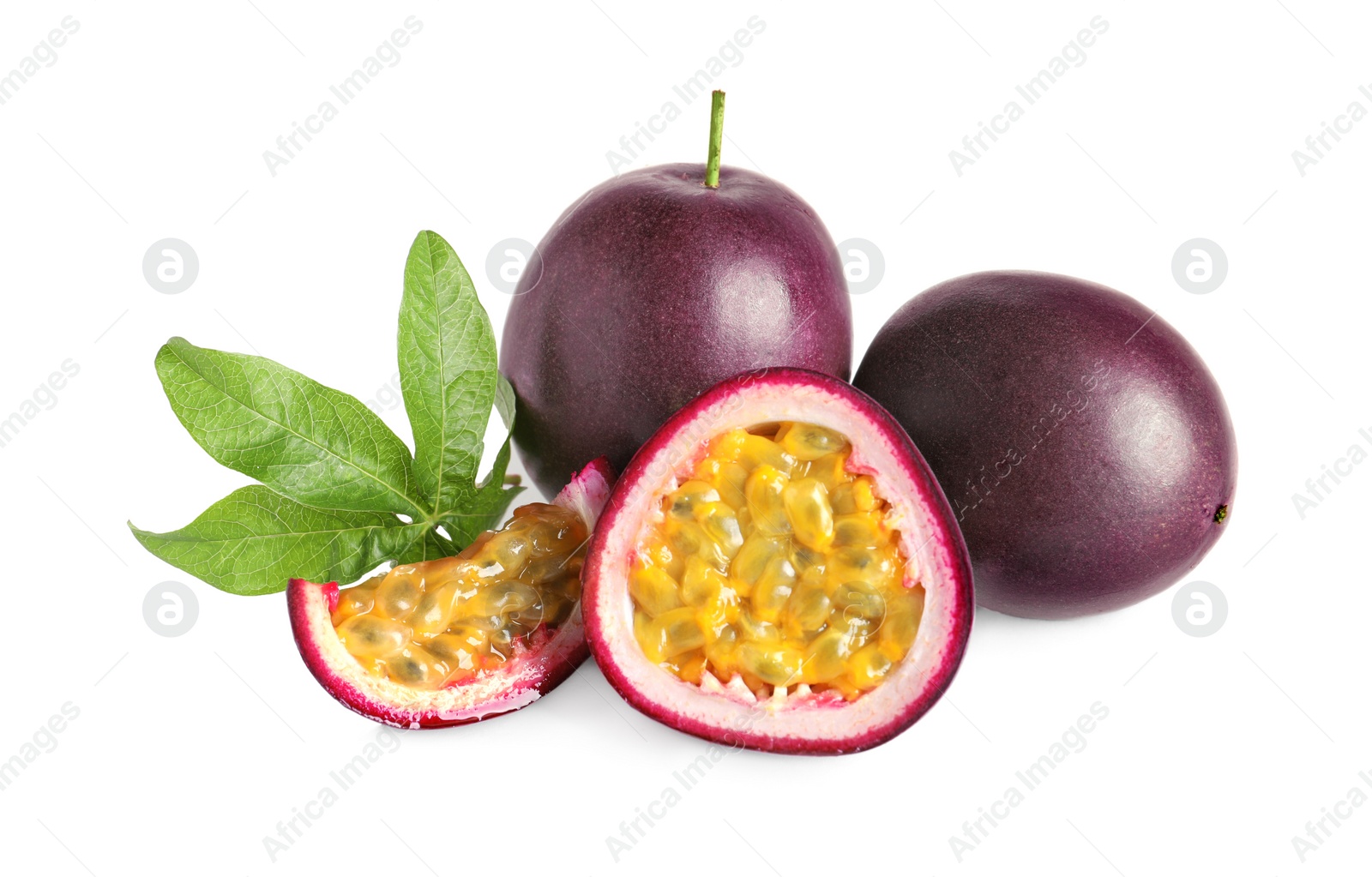 Photo of Cut and whole passion fruits with leaf isolated on white