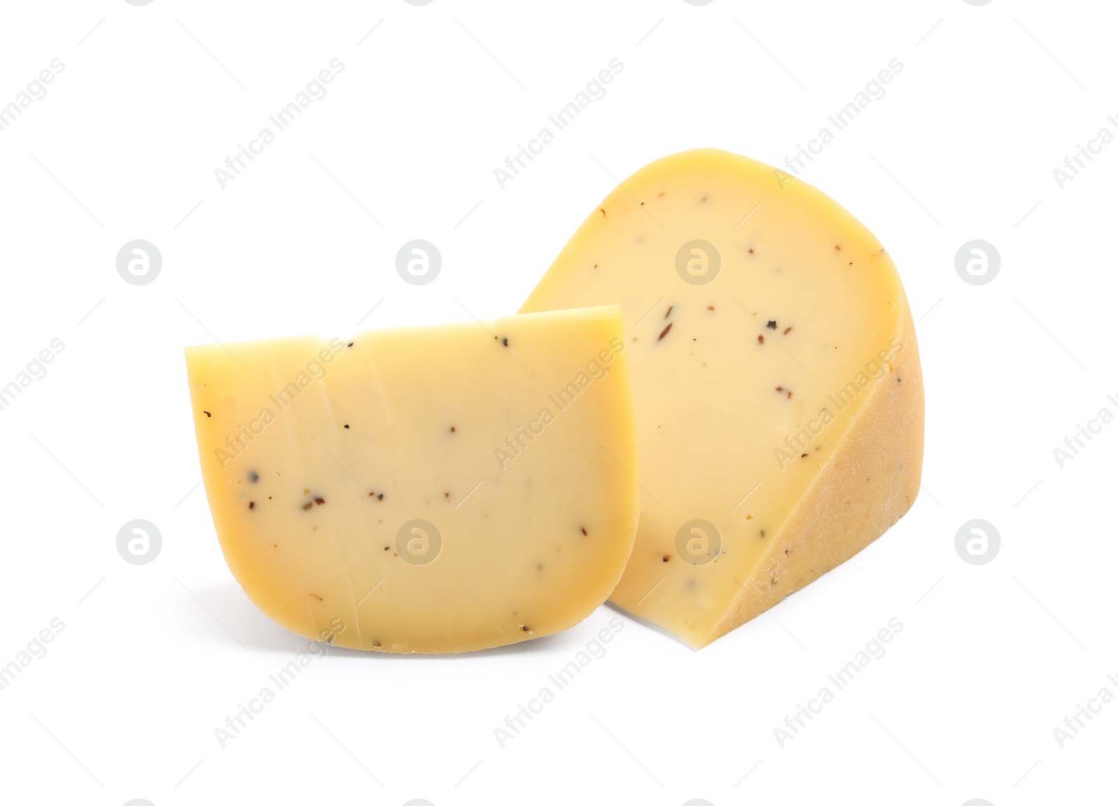 Photo of Pieces of delicious truffle cheese on white background