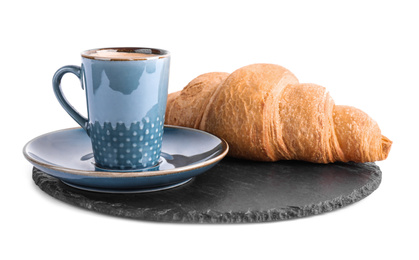 Tasty fresh croissant and coffee on white background