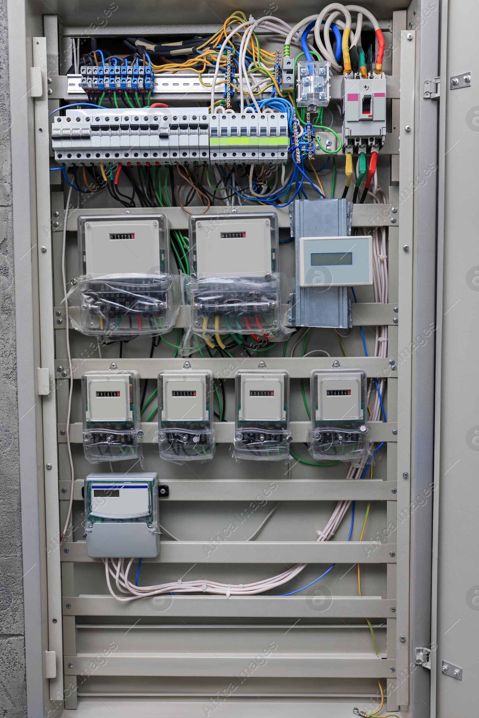 Photo of Fuse box with many electric meters and wires