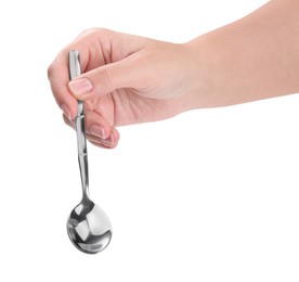 Woman holding new shiny spoon on white background, closeup