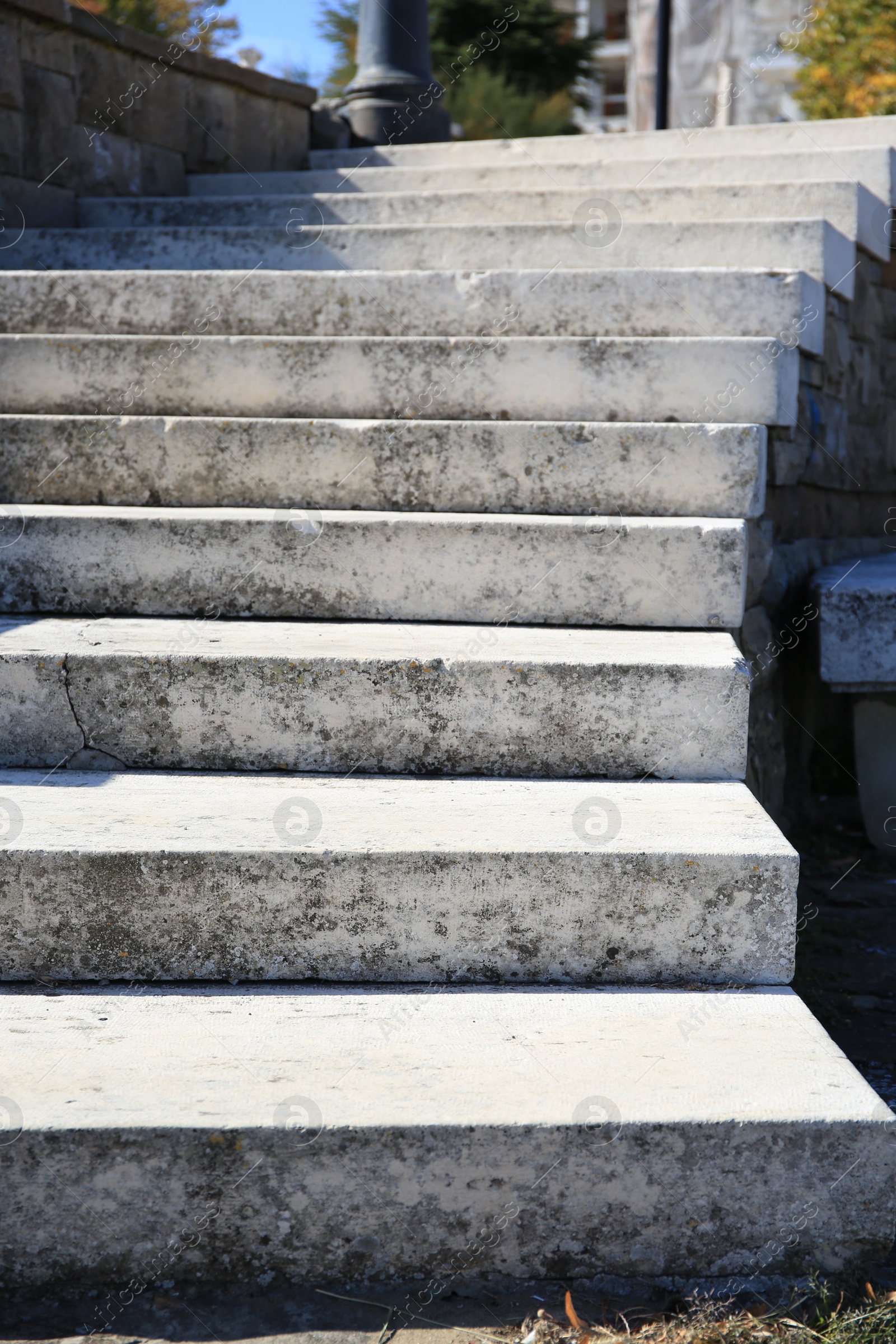 Photo of View of empty old concrete staircase outdoors on sunny day