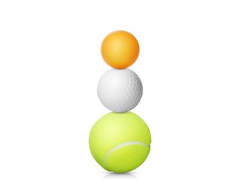 Image of Stack of different sport balls on white background