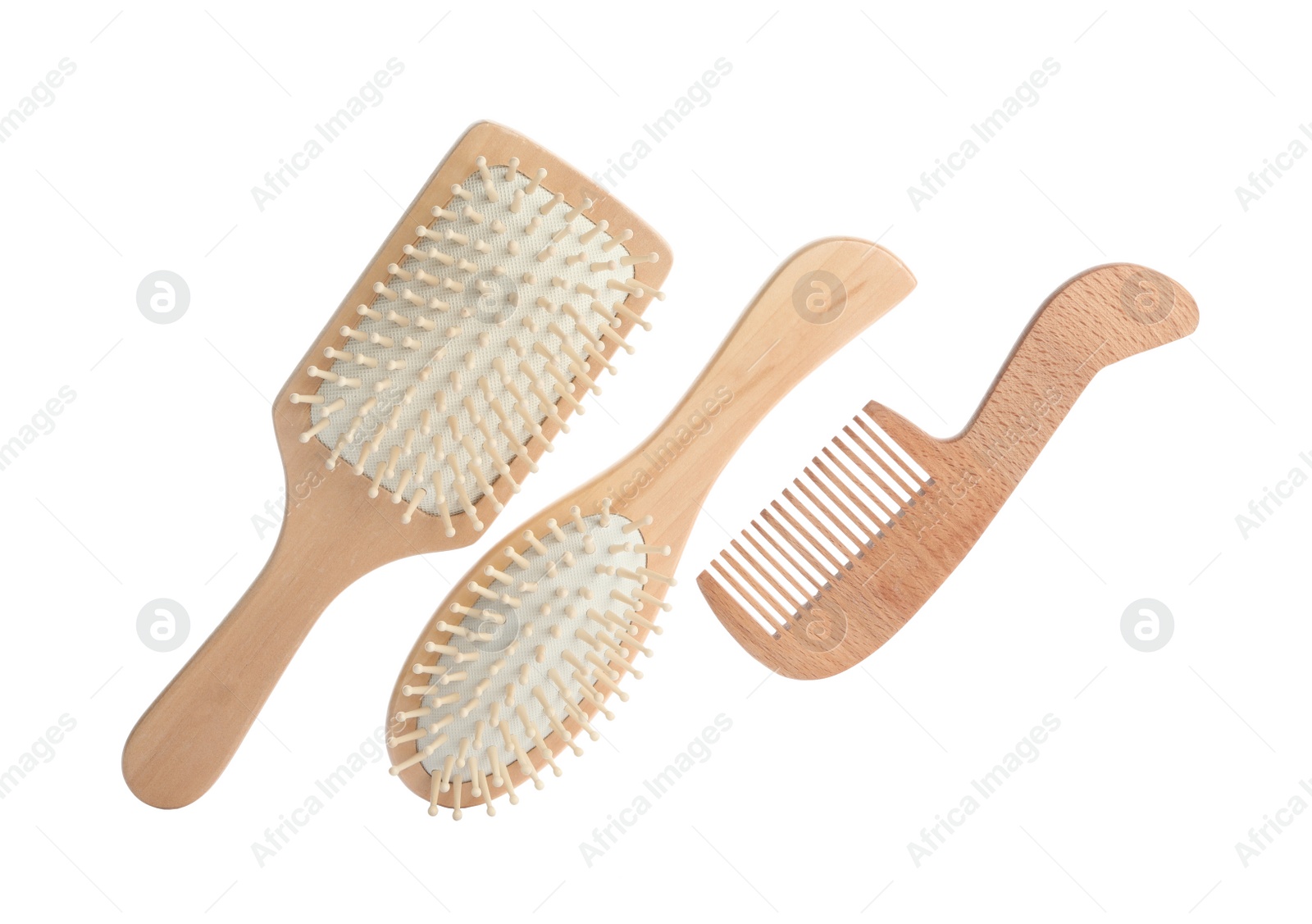 Photo of Different wooden hair brush and comb on white background, top view