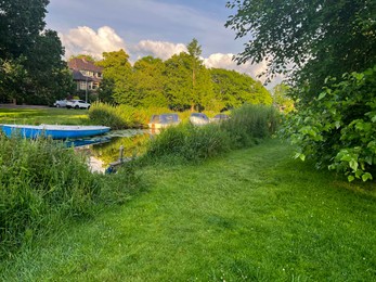 Beautiful view of moored boats in canal on sunny day