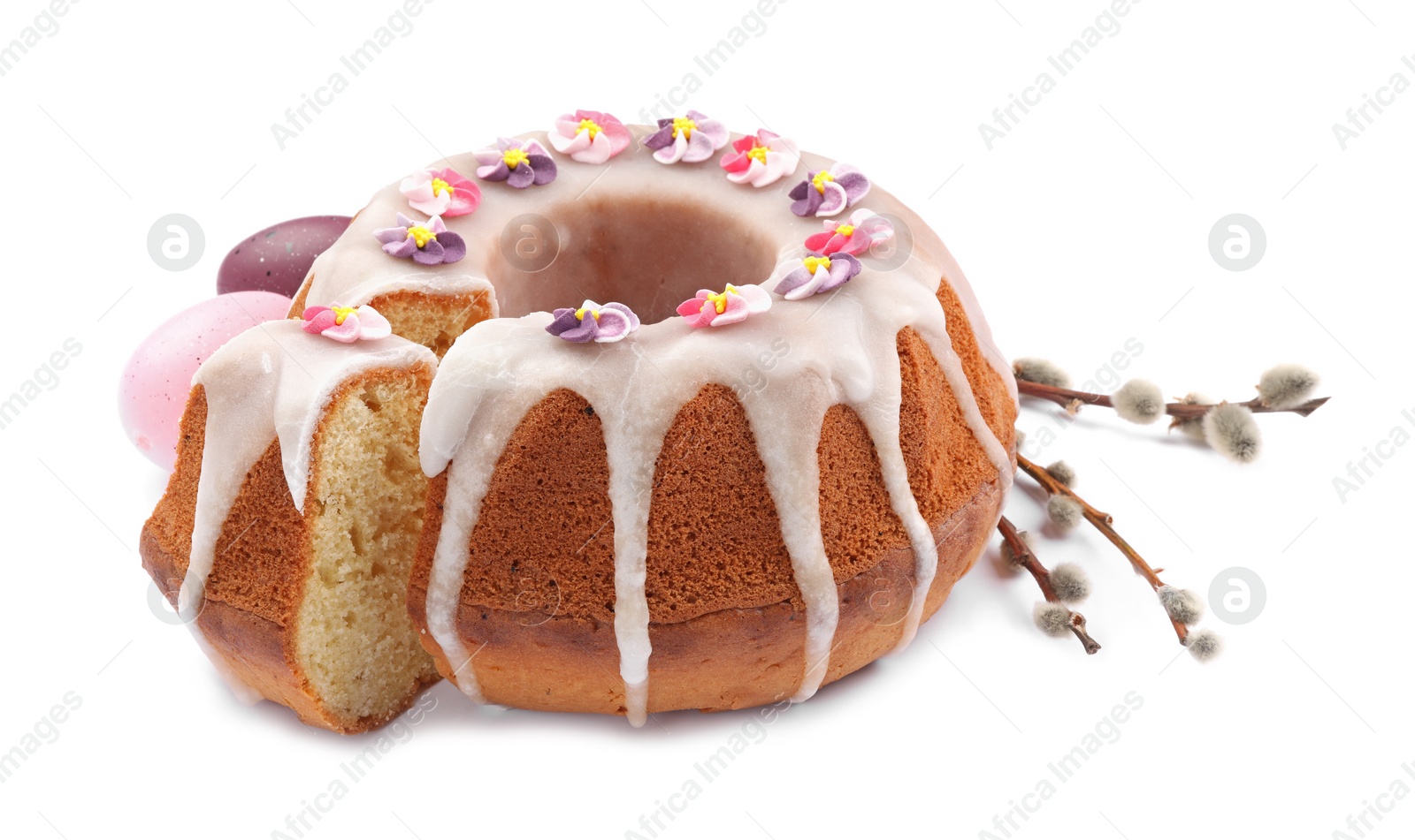 Photo of Festively decorated Easter cake, painted eggs and pussy willow branches on white background
