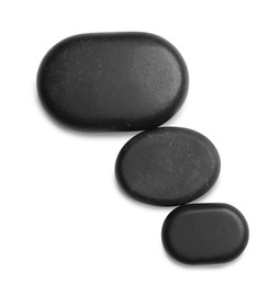 Group of black stones on white background, top view