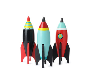 Photo of Bright modern toy rockets isolated on white. Back to school