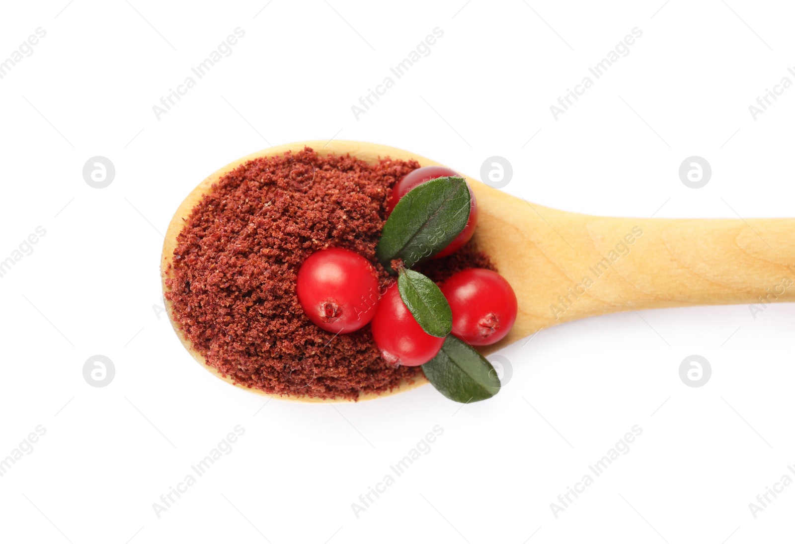 Photo of Wooden spoon with dried cranberry powder, fresh berries and green leaves isolated on white, top view