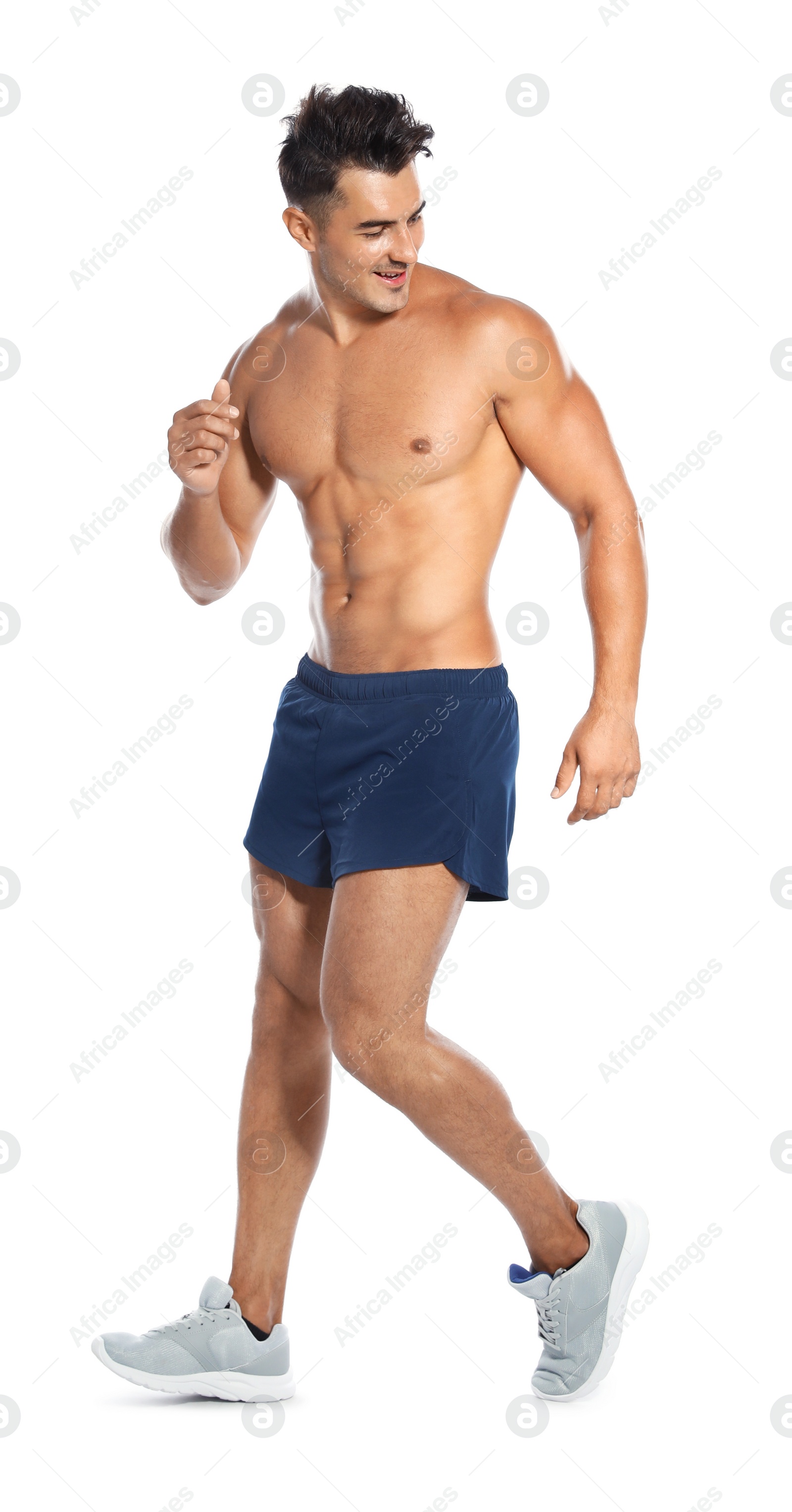 Photo of Handsome young man running on white background