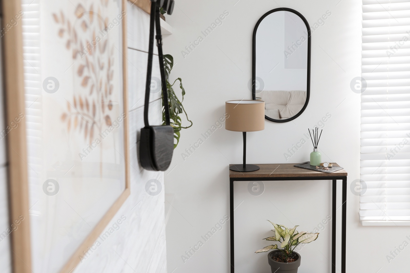 Photo of Hallway interior with console table and stylish decor