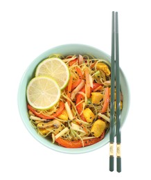 Photo of Stir-fry. Delicious cooked noodles with chicken and vegetables in bowl isolated on white, top view