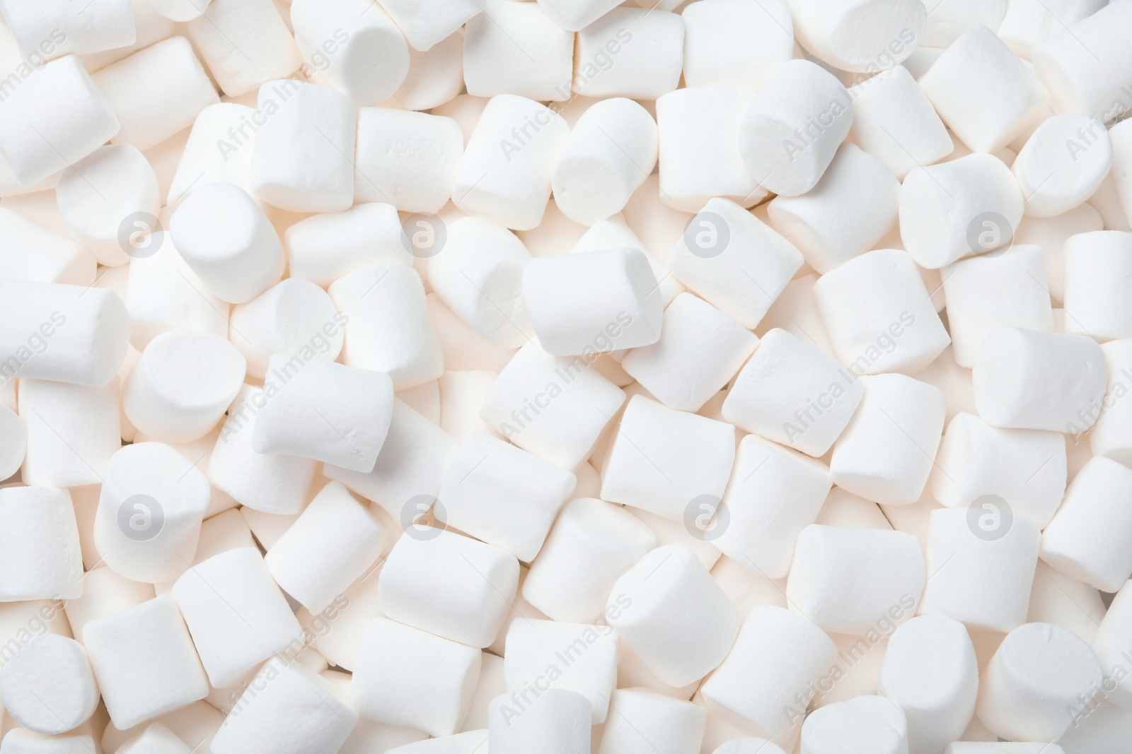 Photo of Delicious white puffy marshmallows as background, top view