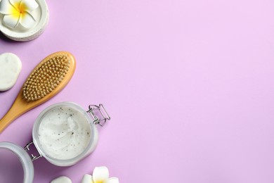 Photo of Flat lay composition with body scrub and brush on pale violet background, space for text