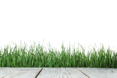 Photo of Wooden deck and green grass isolated on white