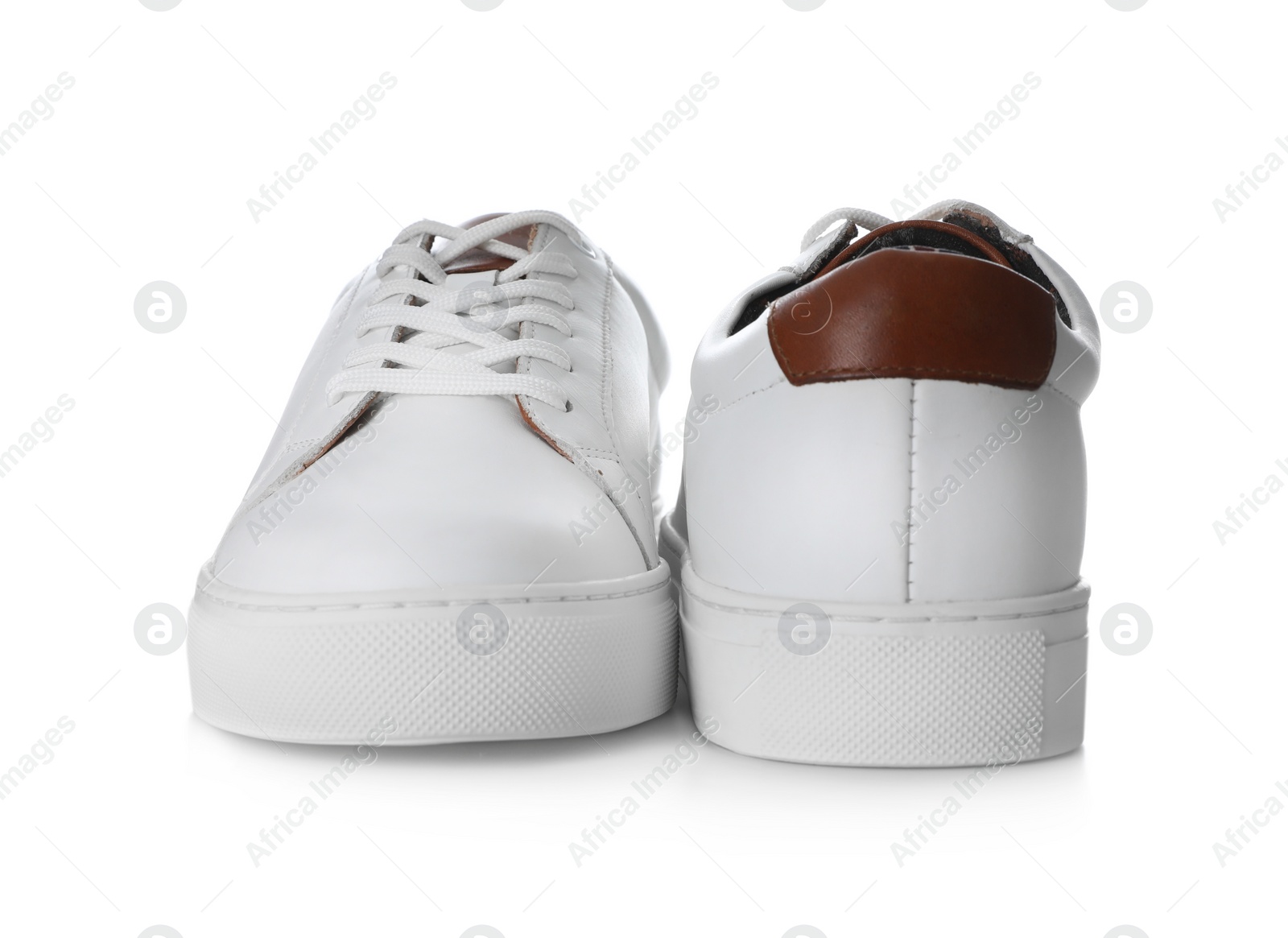 Photo of Pair of stylish sports shoes on white background