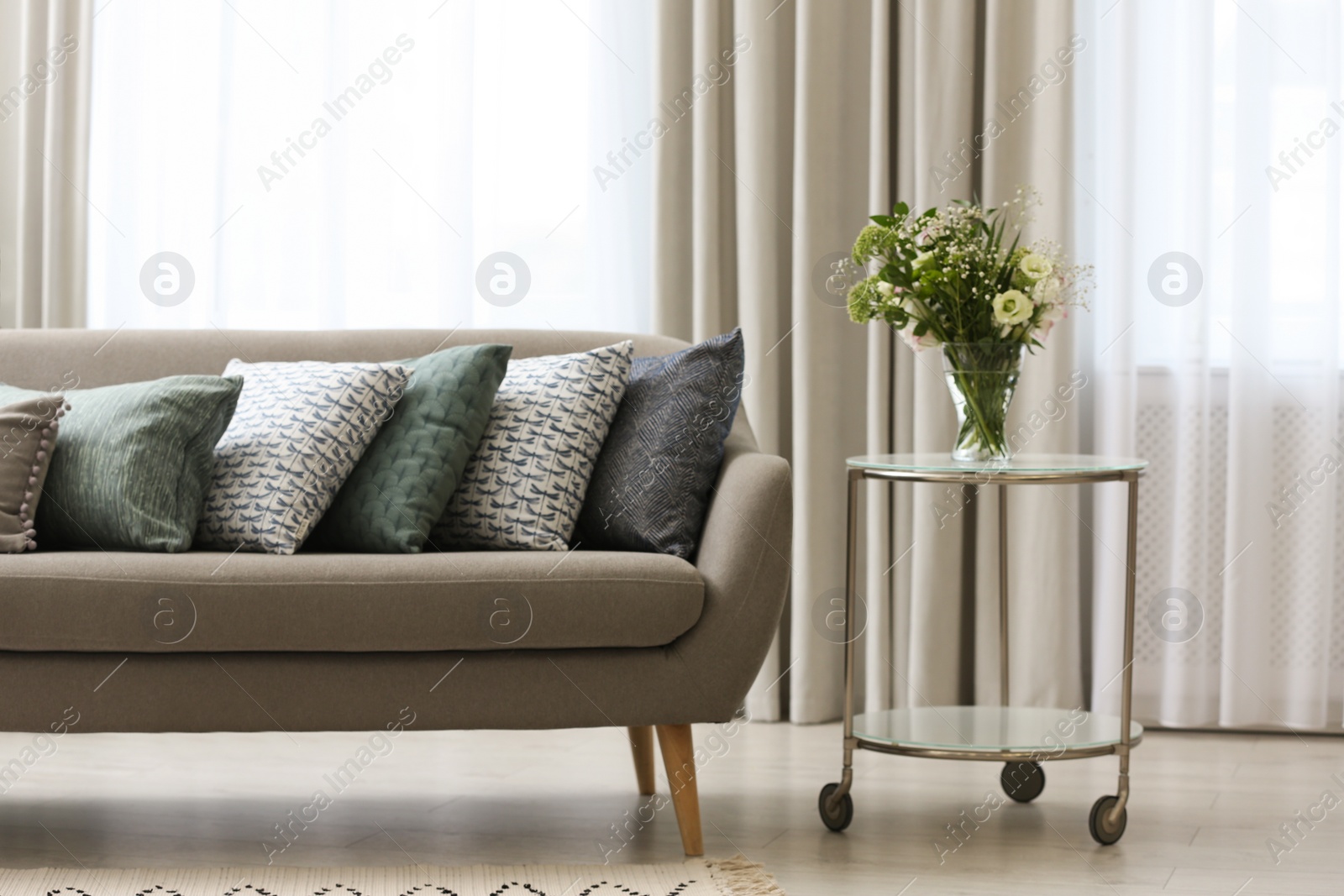 Photo of Sofa with pillows in modern living room interior