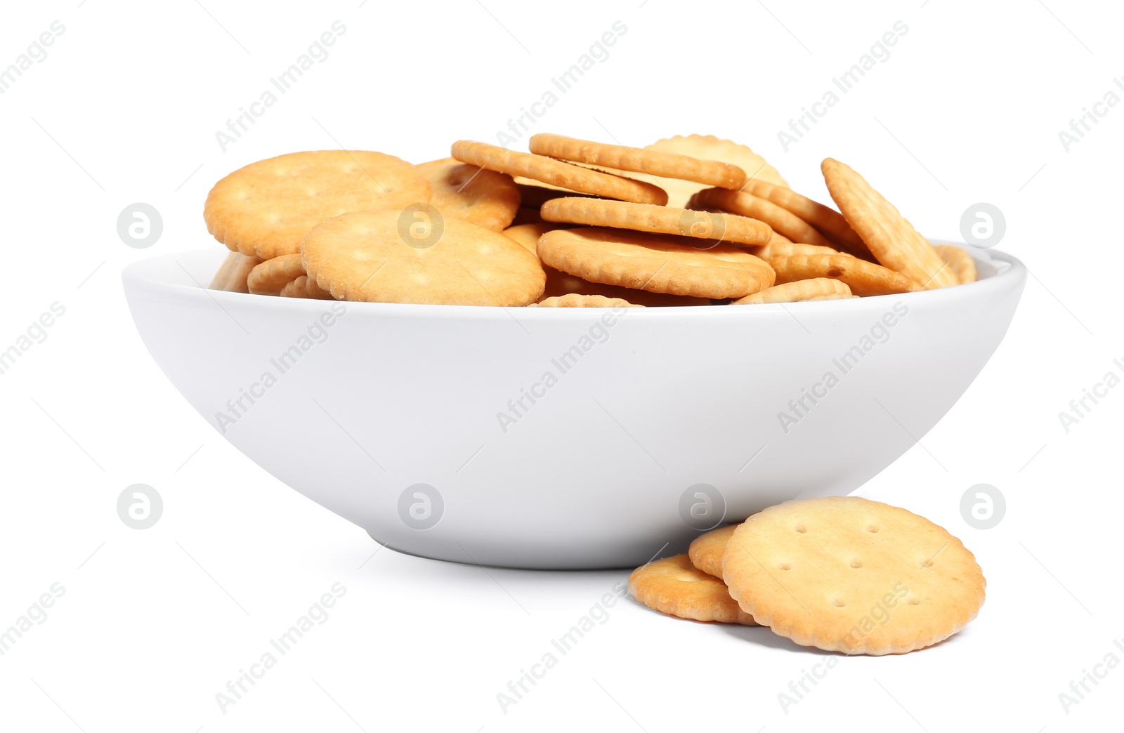 Photo of Tasty crackers in bowl isolated on white