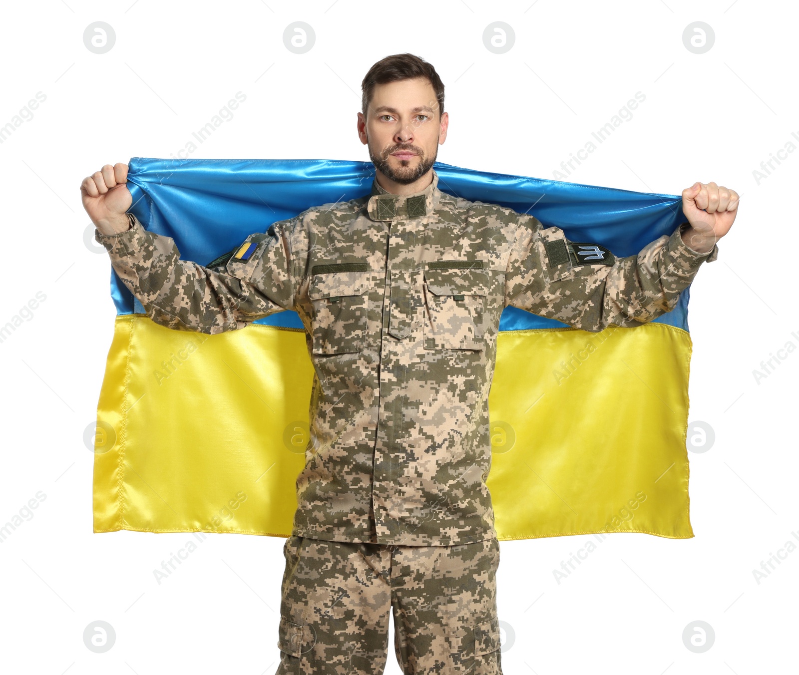 Photo of Soldier in military uniform with Ukrainian flag on white background