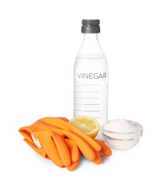 Photo of Eco friendly natural cleaners. Vinegar in bottle, gloves, cut lemon and bowl of soda isolated on white