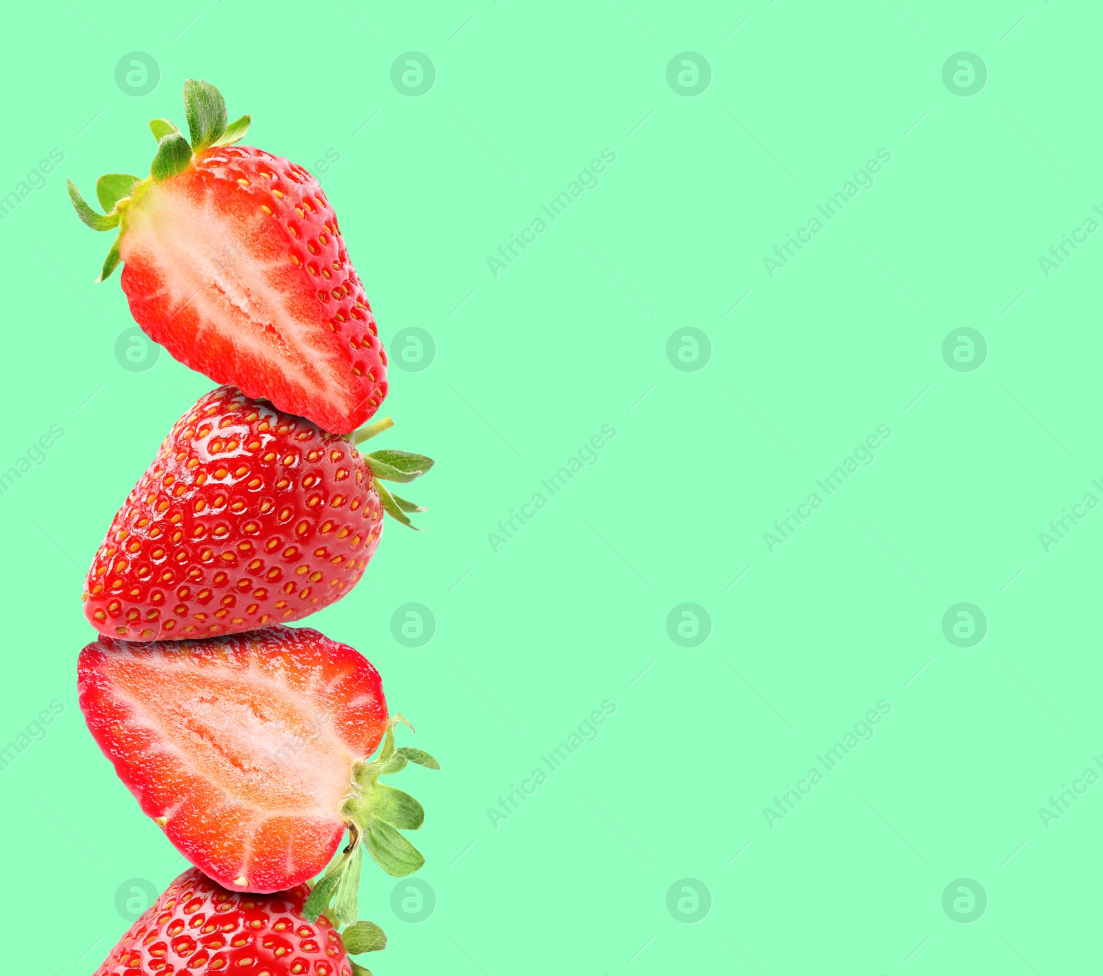 Image of Stack of fresh strawberries on aquamarine background, space for text