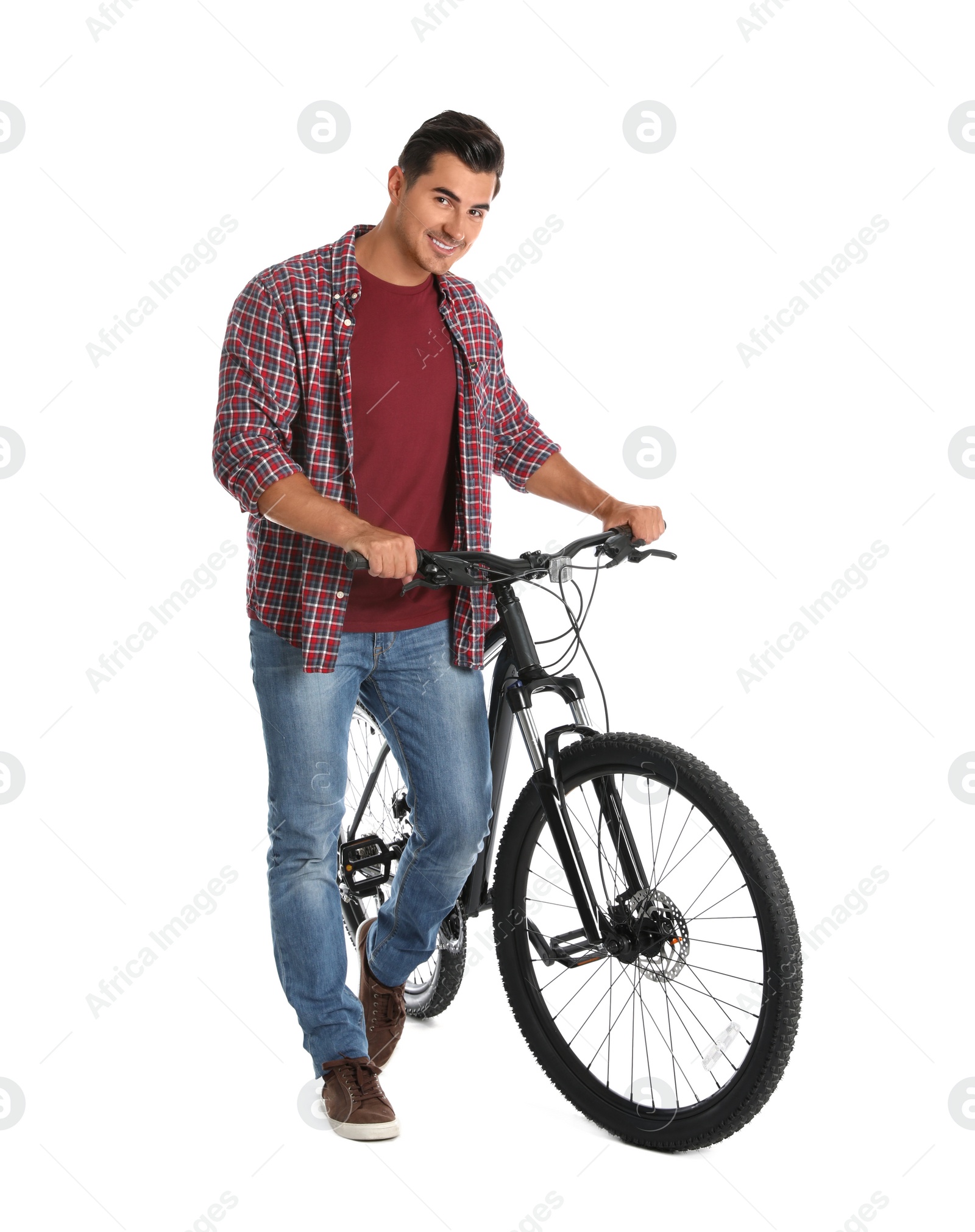 Photo of Handsome young man with modern bicycle on white background