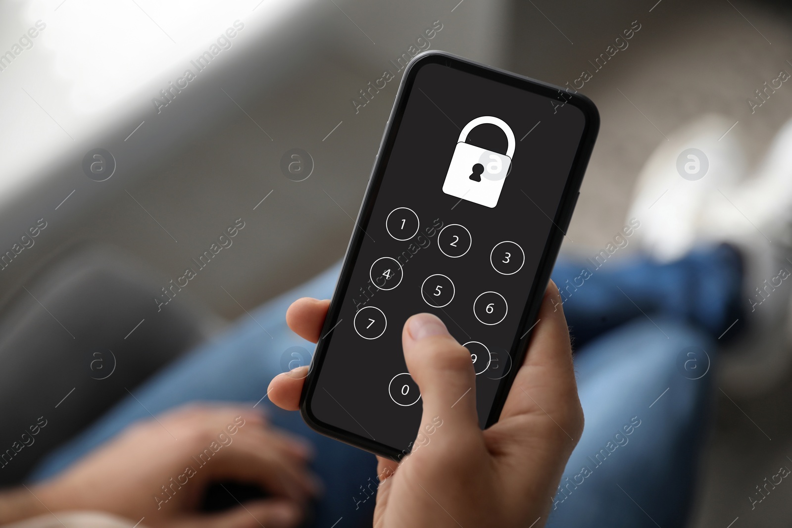 Image of Privacy protection. Man entering pin code on smartphone, closeup. Lock and numpad on screen