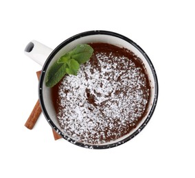 Photo of Tasty chocolate mug pie with mint and cinnamon sticks isolated on white, top view. Microwave cake recipe