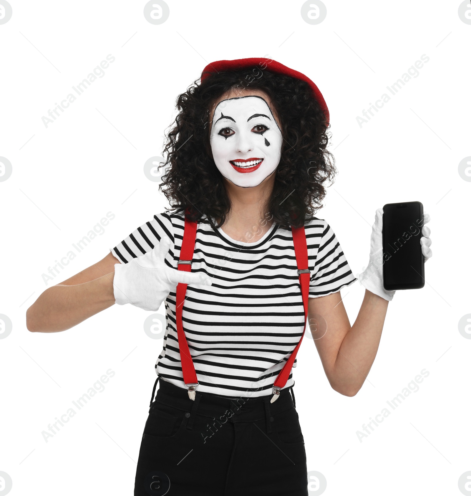 Photo of Funny mime with smartphone posing on white background