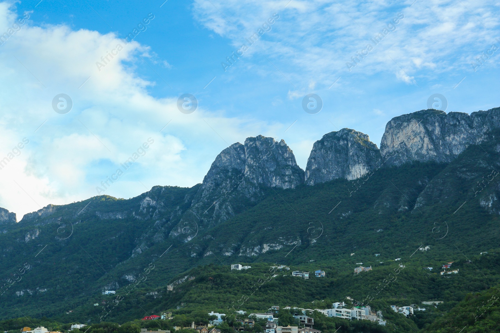 Photo of Picturesque view of mountain landscape and city