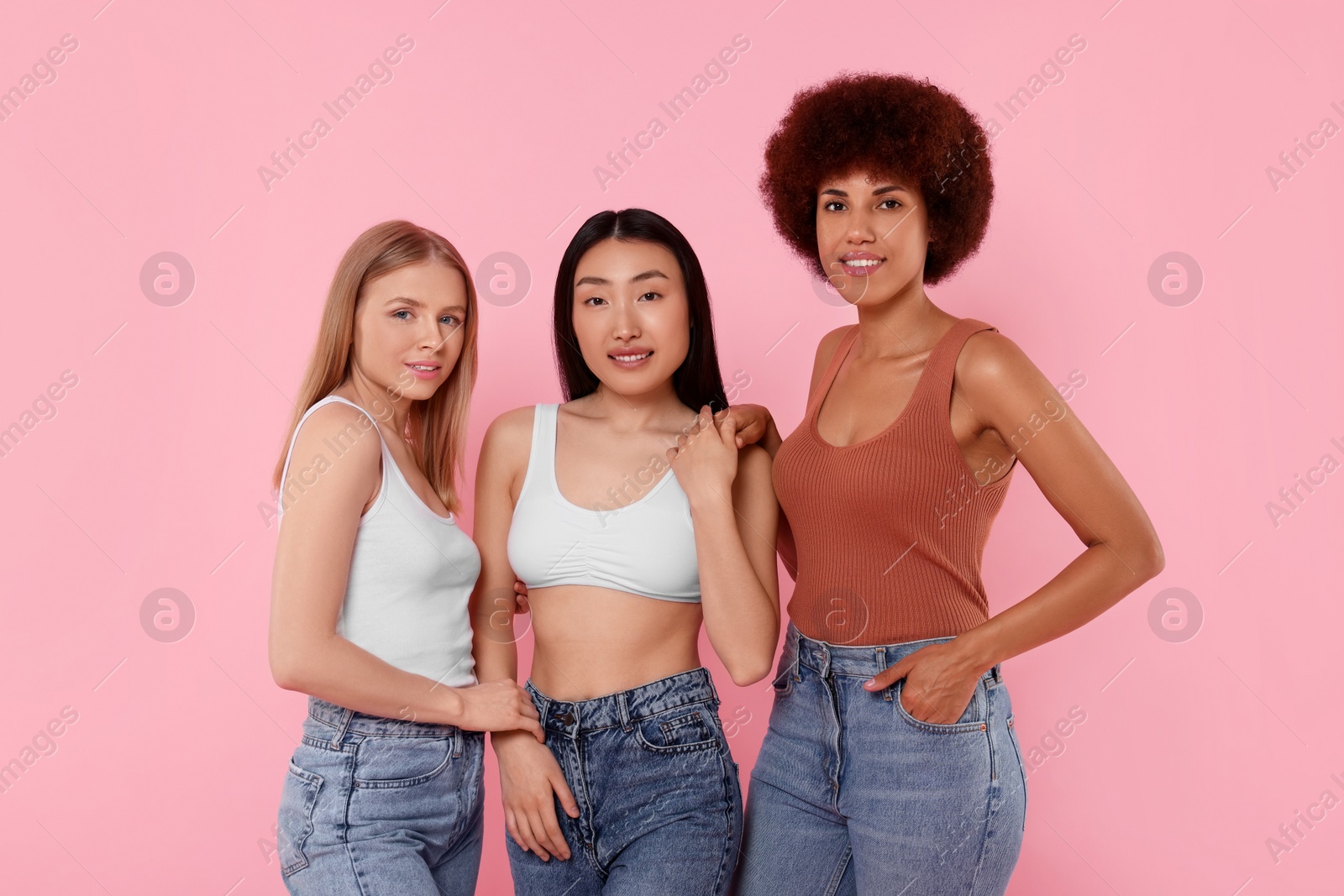 Photo of Portrait of beautiful young women on pink background