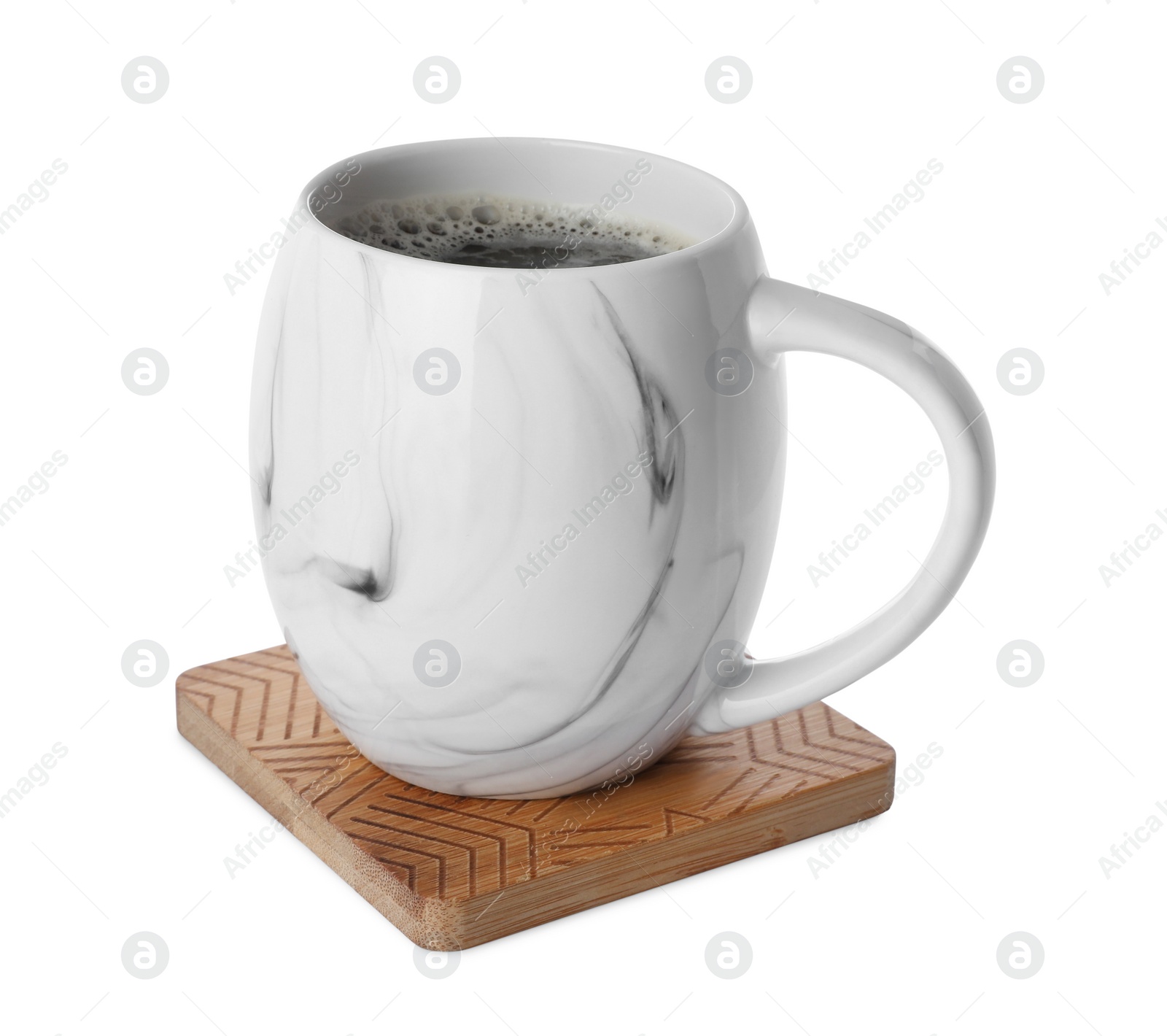 Photo of Mug of coffee and stylish wooden cup coaster isolated on white