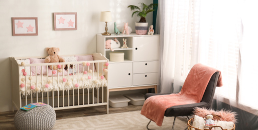 Image of Baby room interior with comfortable crib. Banner design