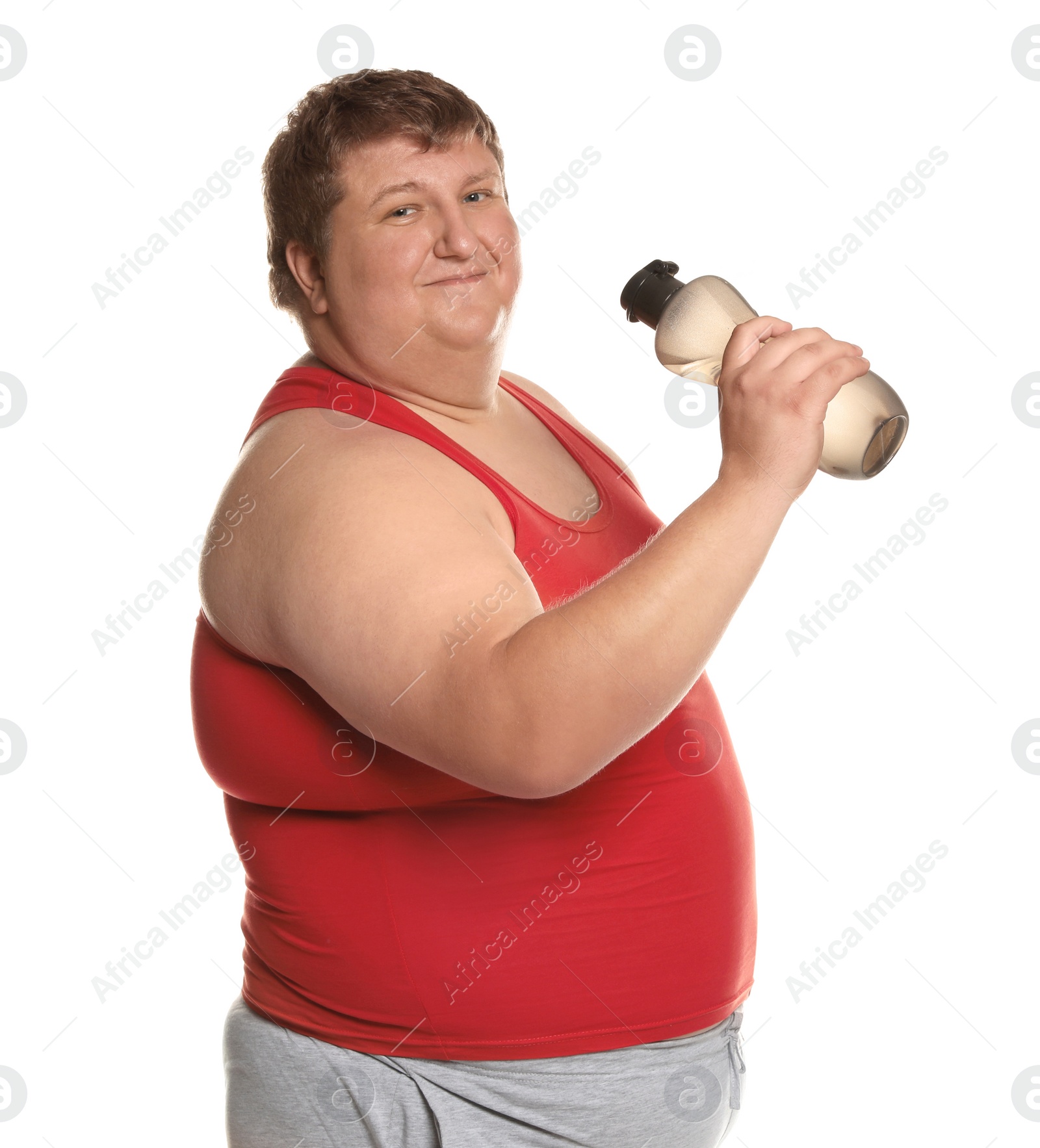 Photo of Portrait of overweight man with bottle of water on white background