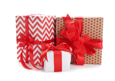 Photo of Beautifully decorated gift boxes on white background