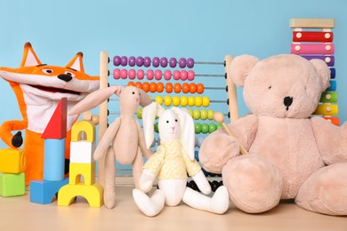 Collection of different toys on wooden table