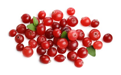 Photo of Pile of fresh ripe cranberries with leaves isolated on white, top view