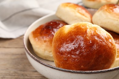 Tasty scones prepared on soda water on wooden table, closeup. Space for text