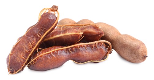 Delicious ripe tamarinds on white background. Exotic fruit