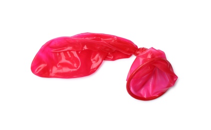 Photo of Red used condom on white background. Safe sex concept