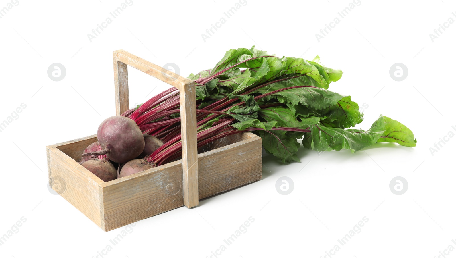 Photo of Raw ripe beets in wooden basket isolated on white