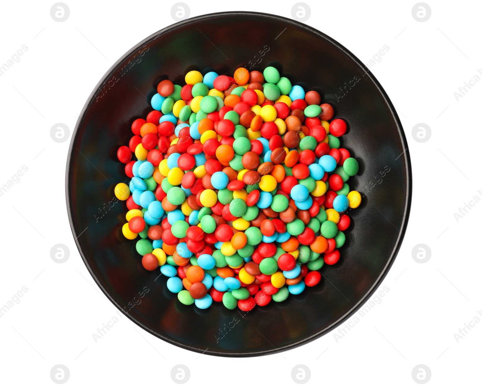 Photo of Bowl with colorful candies isolated on white, top view