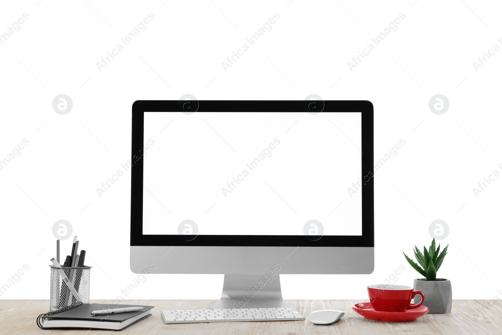 Photo of Computer, potted plants and stationery on table against white background. Stylish workplace