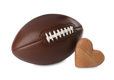 Photo of American football ball and heart on white background