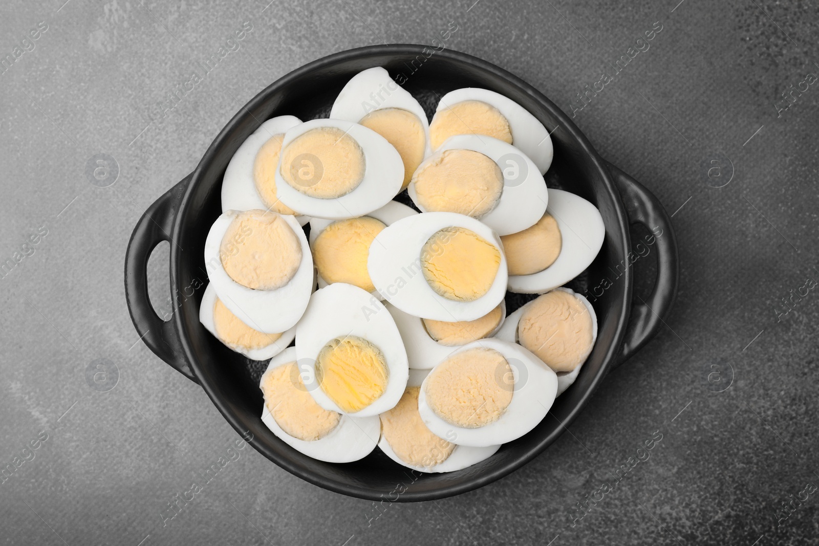 Photo of Fresh hard boiled eggs on brown table, top view
