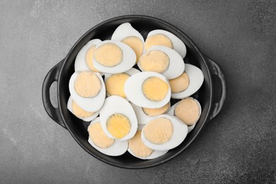 Fresh hard boiled eggs on brown table, top view