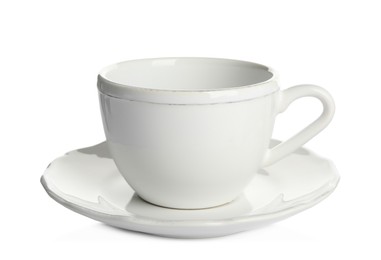 Photo of Empty ceramic cup and saucer isolated on white