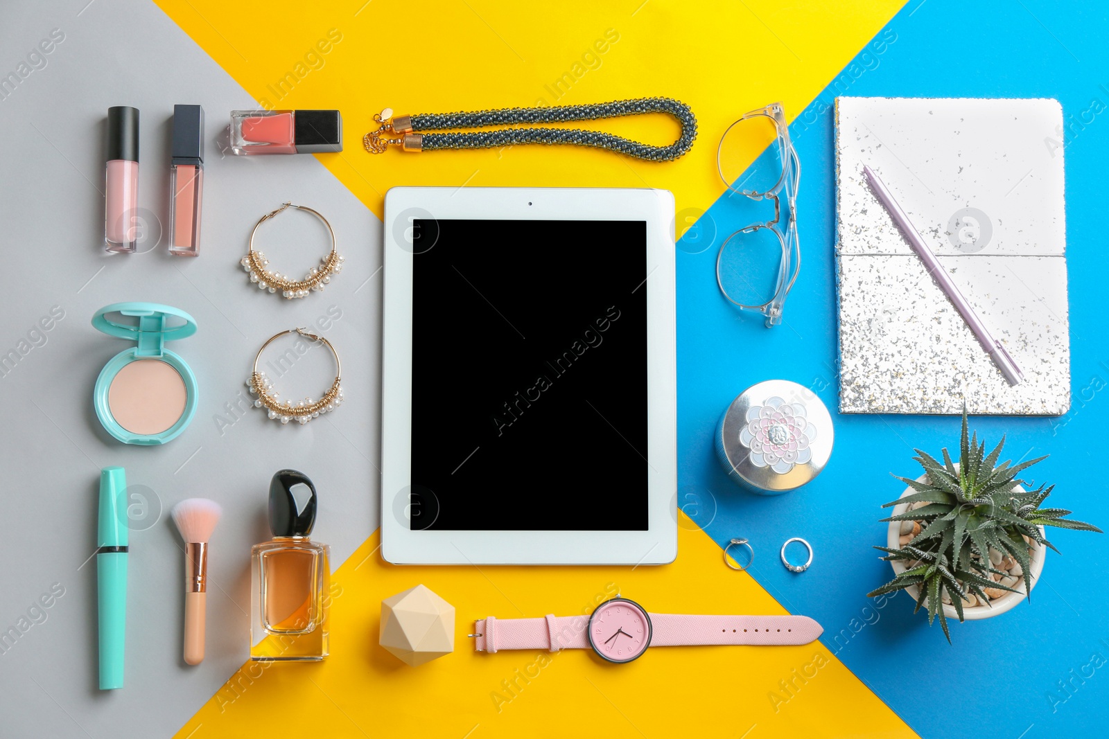 Photo of Flat lay composition with tablet, makeup products and accessories on color background, space for text. Beauty blogger