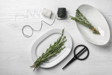 Photo of Flat lay composition with rosemary on table. Aromatic herbs